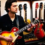 기타 합주 시 고려 사항 - **Prompt:** A discerning male guitarist, in his late 20s, with a stylish yet casual appearance, stan...