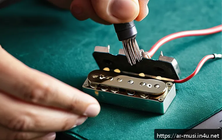 기타 픽업 설치 방법 - A detailed close-up image of a professional guitarist&rsquo;s hands carefully soldering wires to a new hum...